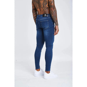 mens dark blue skinny fit stretch denim jeans angled back view modern slim fit mens denim jeans